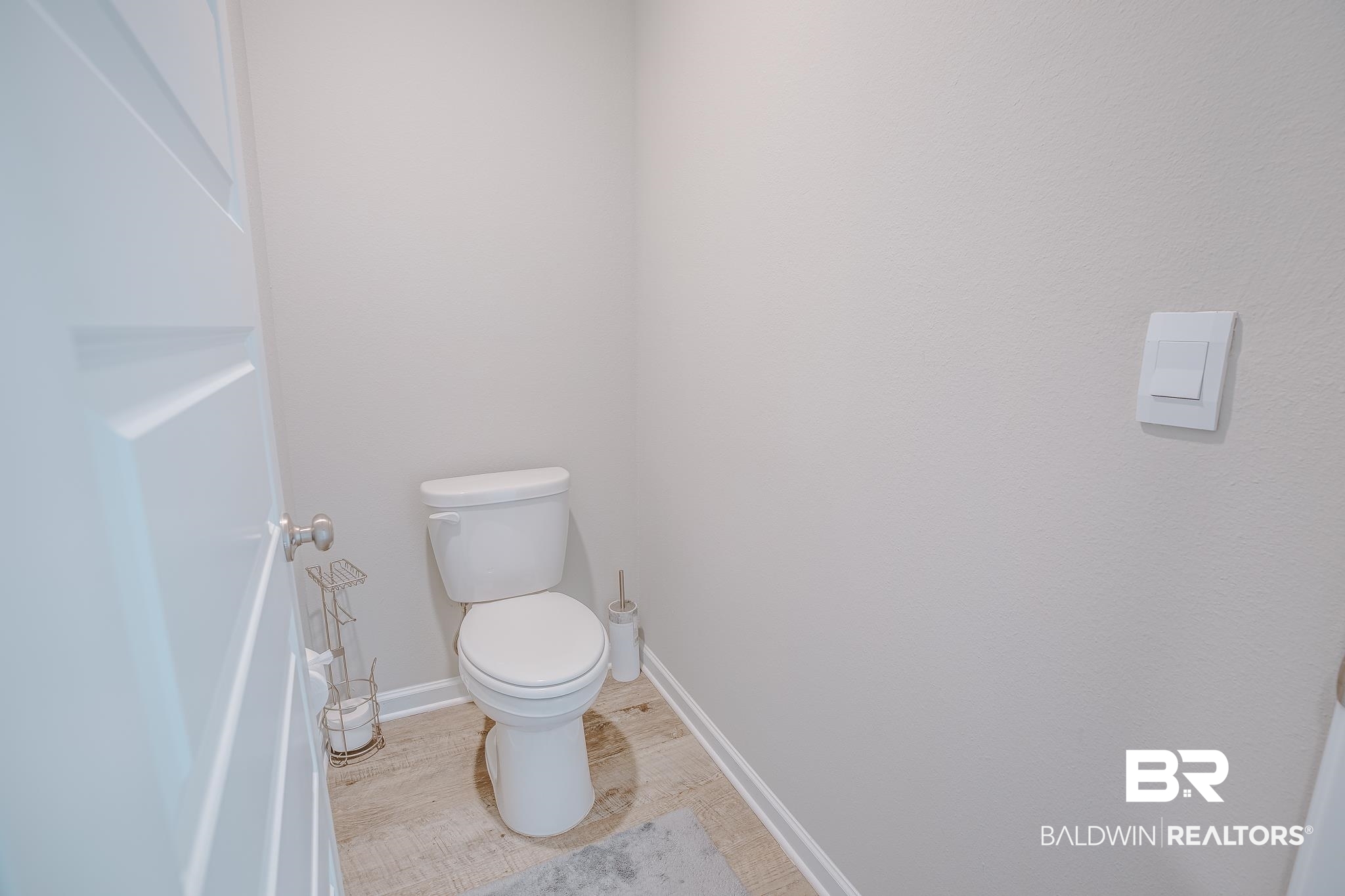 8242 Sycamore Way Semmes, AL 36575 - Photo 21 of 43 Bathroom with toilet and wood finished floors