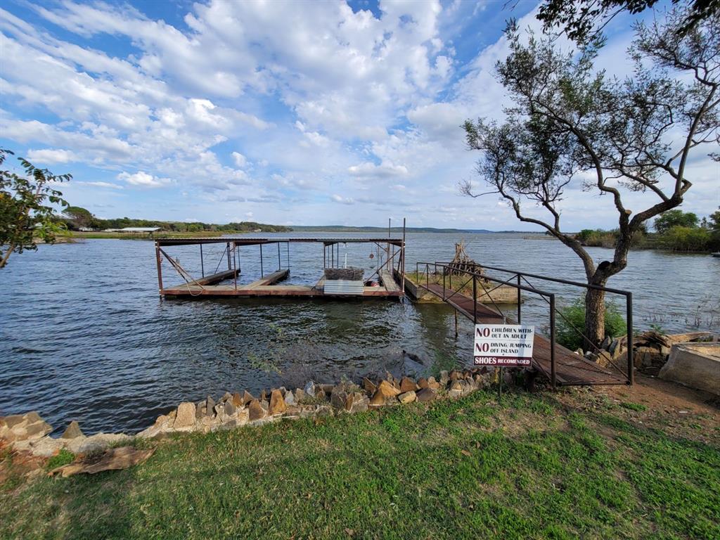 161 Alexander Drive, Unit 8 Tow, TX 78672 - Photo 1 of 13 a view of swimming pool with a yard