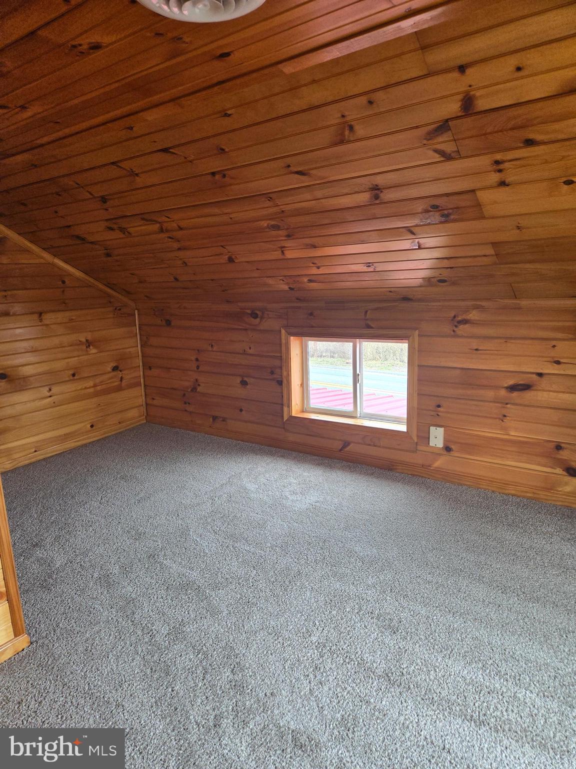 386 Specks Run Road Bunker Hill, WV 25413 - Photo 14 of 18 a view of a room with a wooden wall