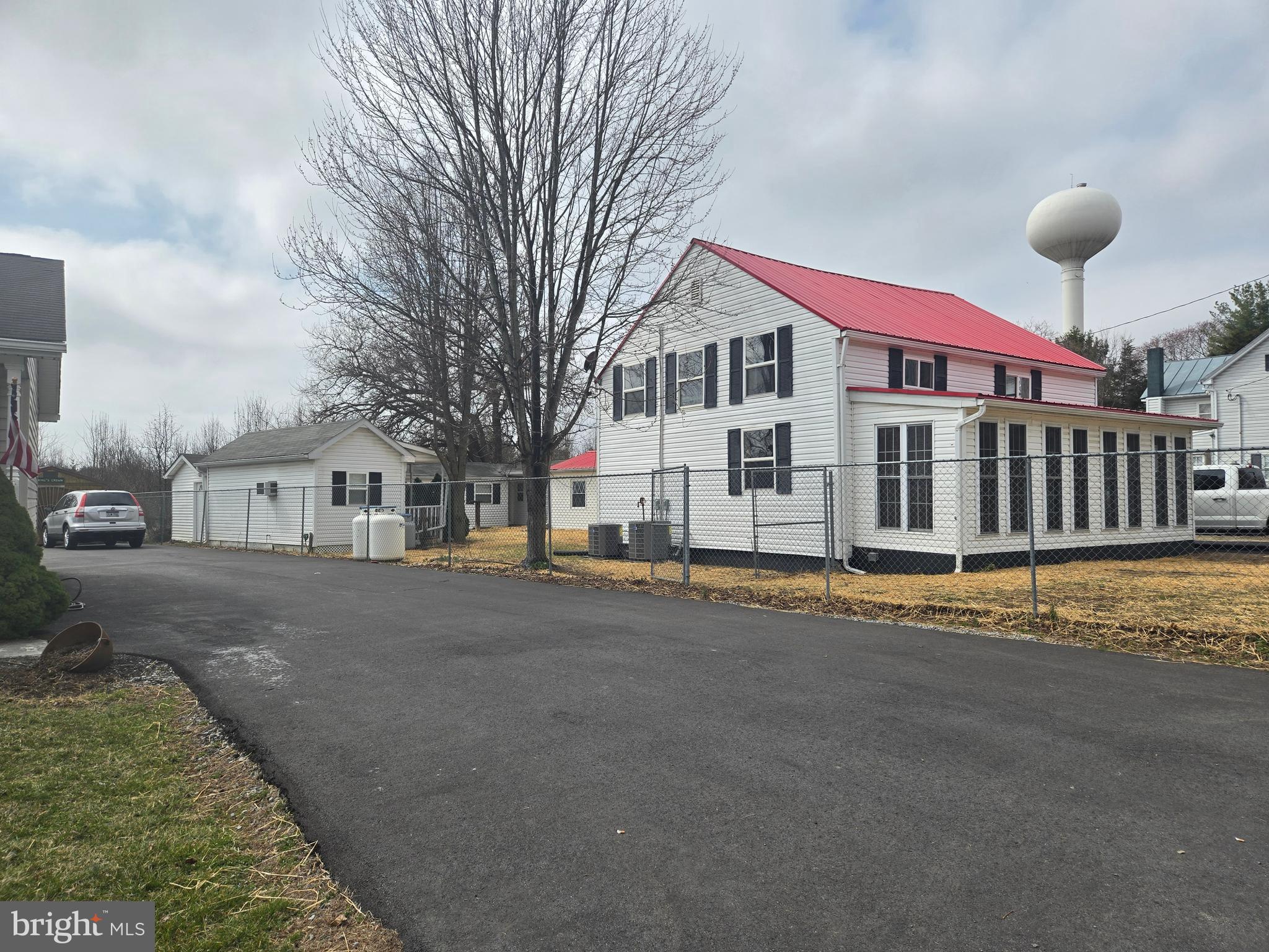 386 Specks Run Road Bunker Hill, WV 25413 - Photo 5 of 18 a view of a white house with a yard
