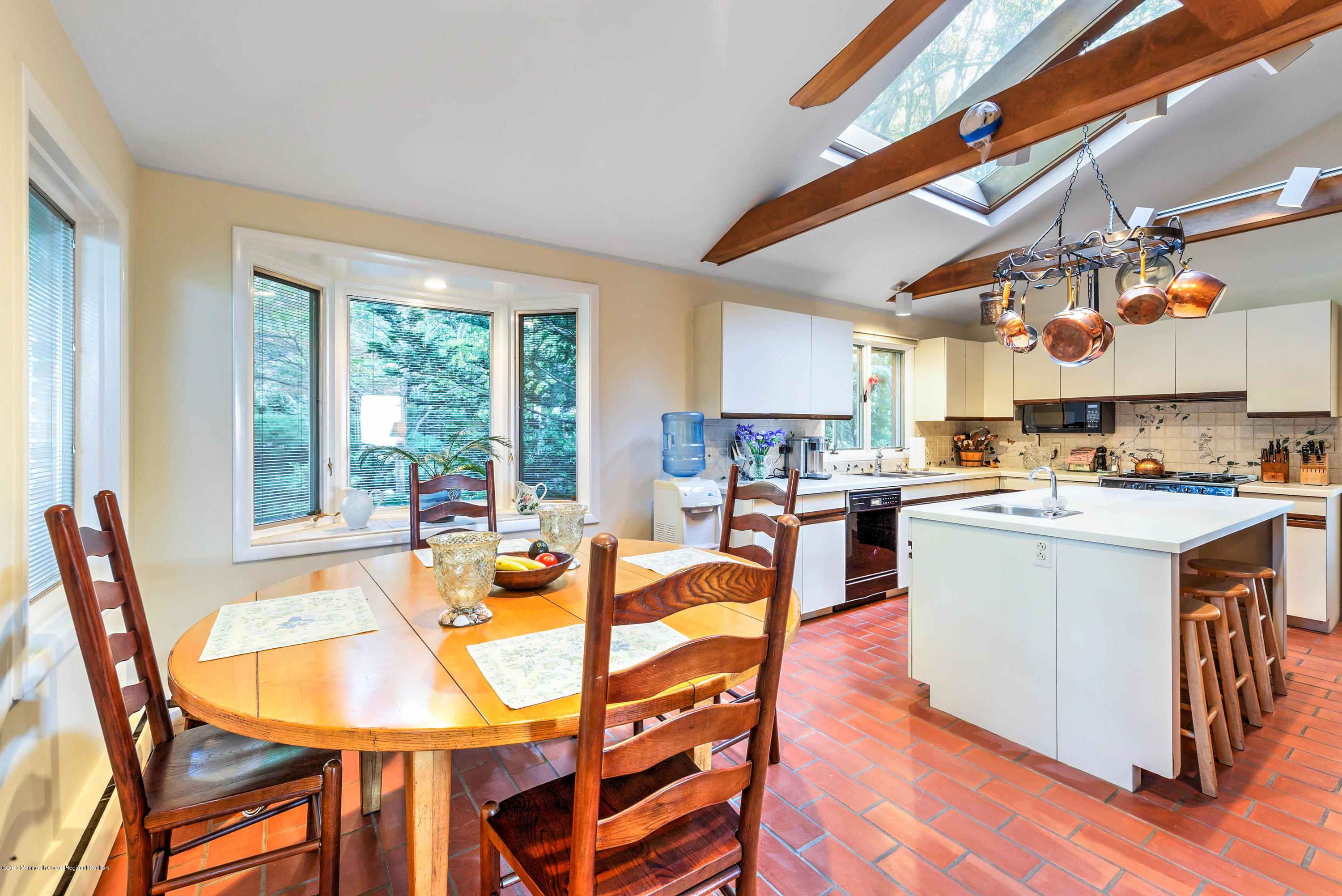 1 Hook Harbor Road Atlantic Highlands, NJ 07716 - Photo 13 of 40 a kitchen with a table chairs and wooden floor