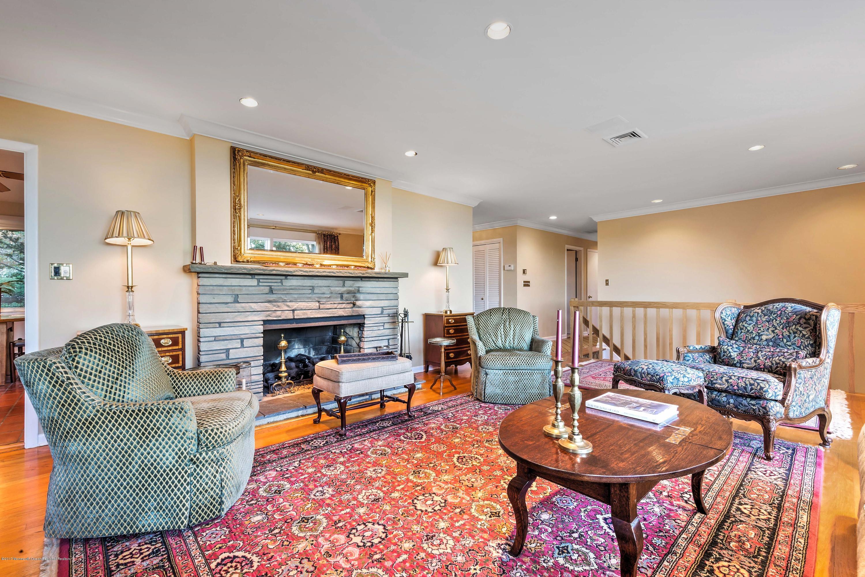 1 Hook Harbor Road Atlantic Highlands, NJ 07716 - Photo 18 of 40 a living room with furniture and a fireplace