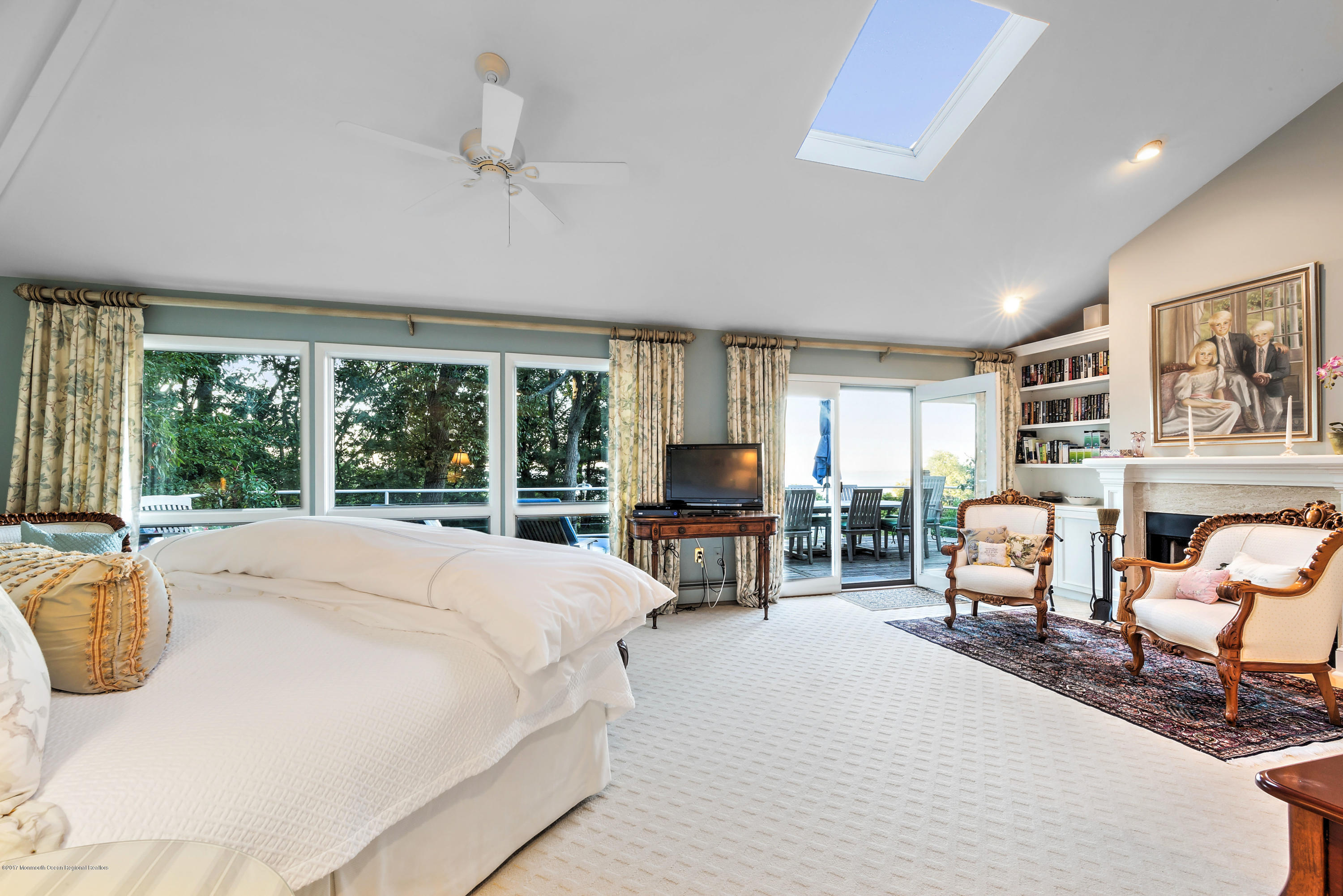 1 Hook Harbor Road Atlantic Highlands, NJ 07716 - Photo 22 of 40 a spacious bedroom with a large bed and a large window
