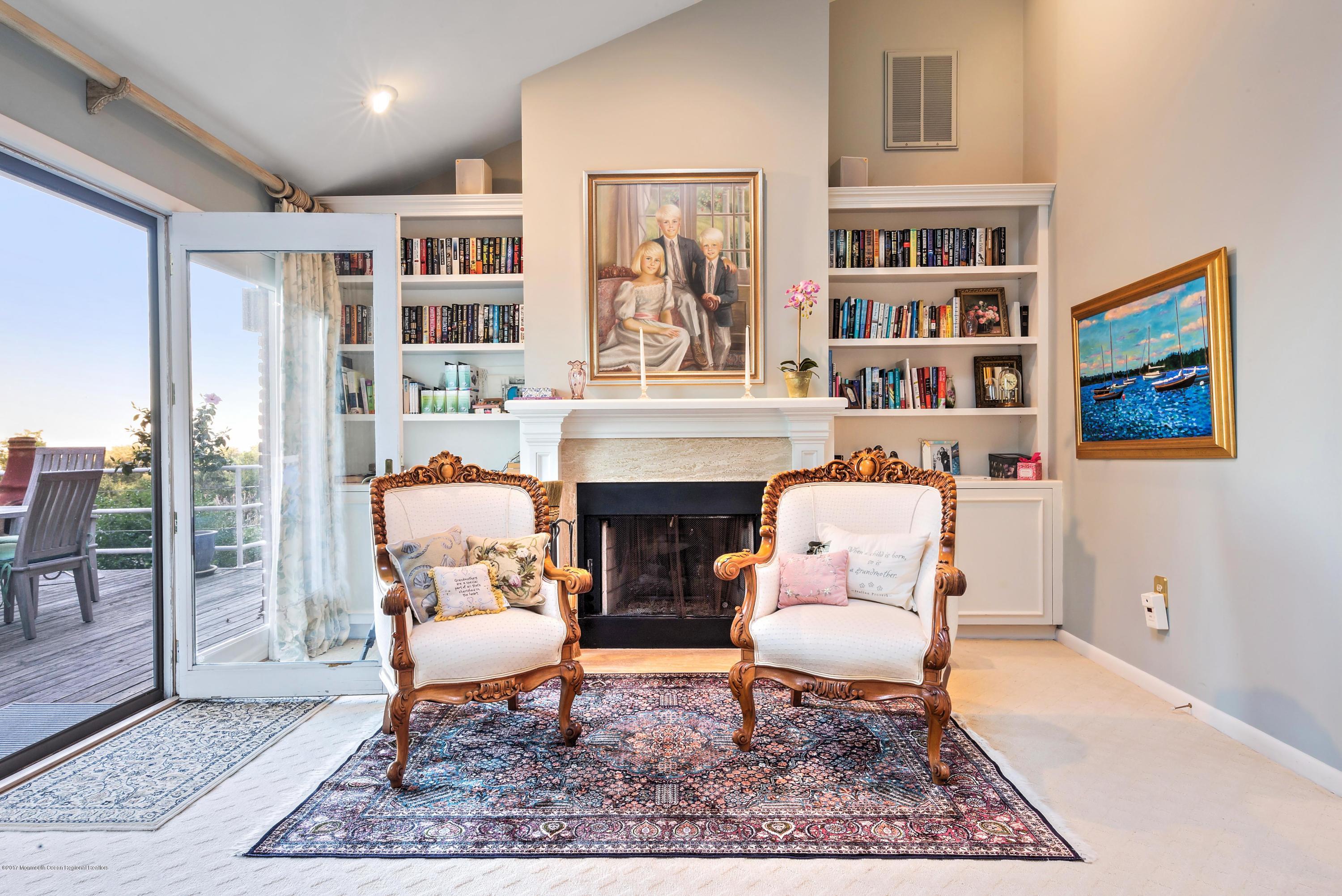 1 Hook Harbor Road Atlantic Highlands, NJ 07716 - Photo 23 of 40 a living room with furniture a rug and a fireplace