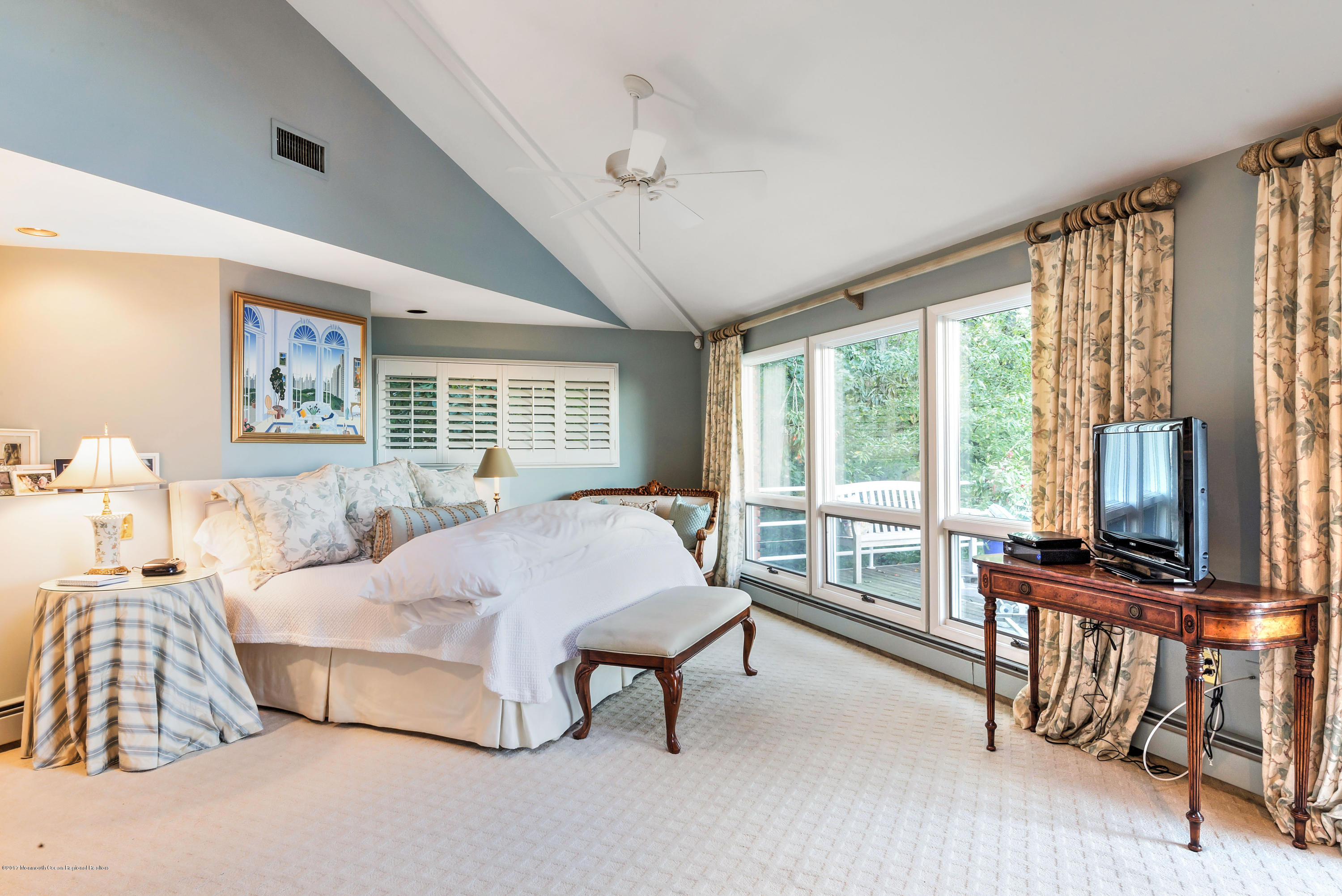 1 Hook Harbor Road Atlantic Highlands, NJ 07716 - Photo 24 of 40 a bedroom with a bed and a flat tv screen next to a large window