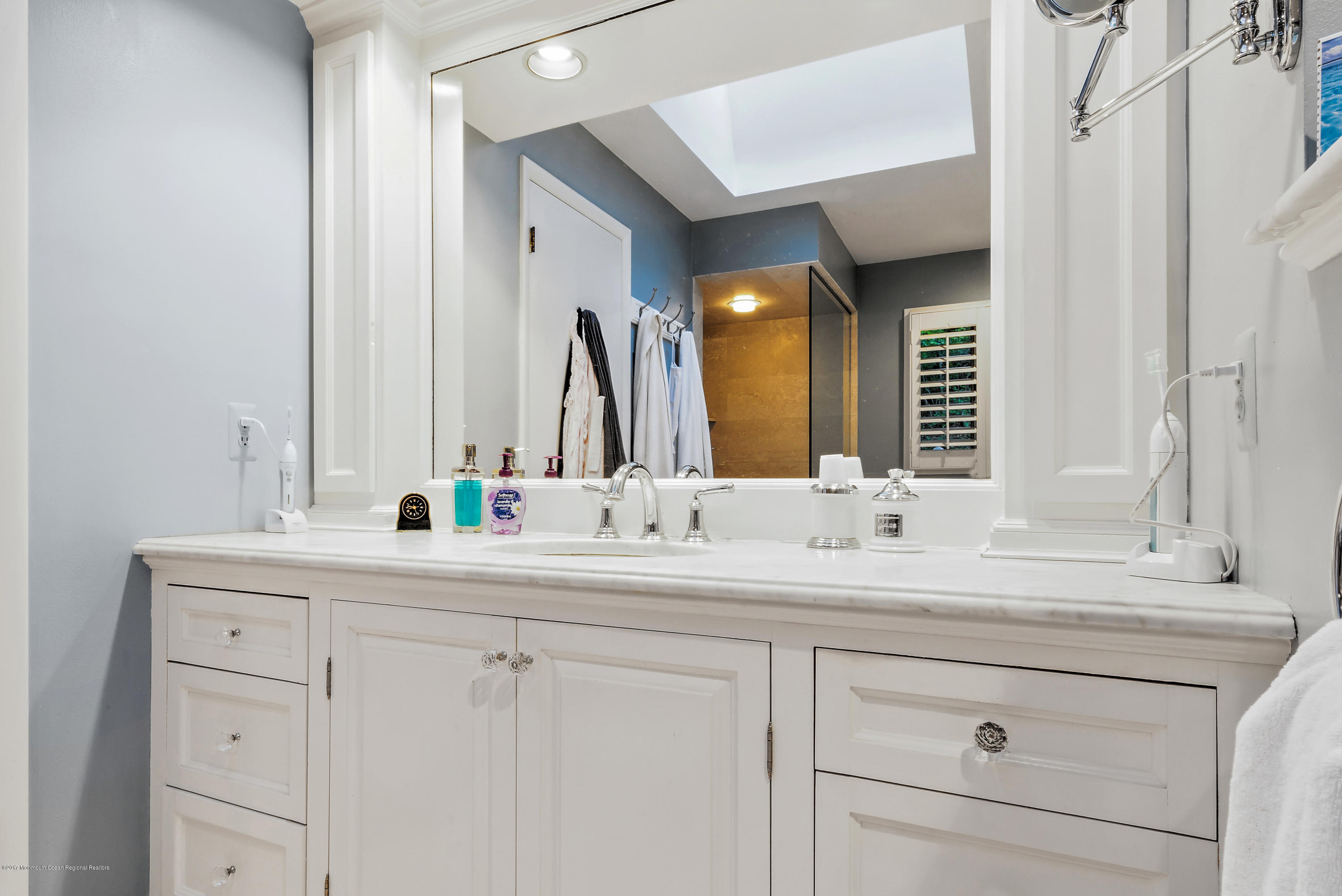 1 Hook Harbor Road Atlantic Highlands, NJ 07716 - Photo 26 of 40 a bathroom with a sink and a mirror