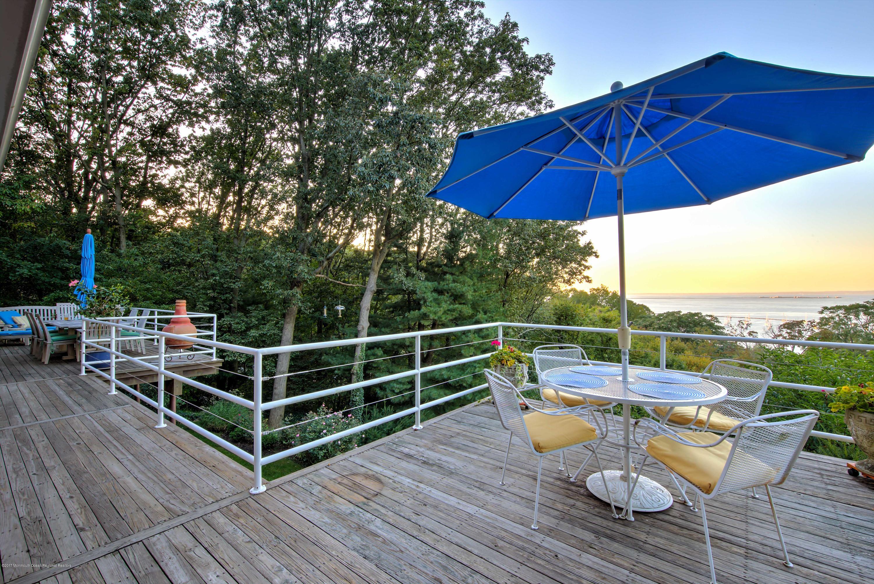 1 Hook Harbor Road Atlantic Highlands, NJ 07716 - Photo 31 of 40 an outdoor sitting area with furniture and wooden tub