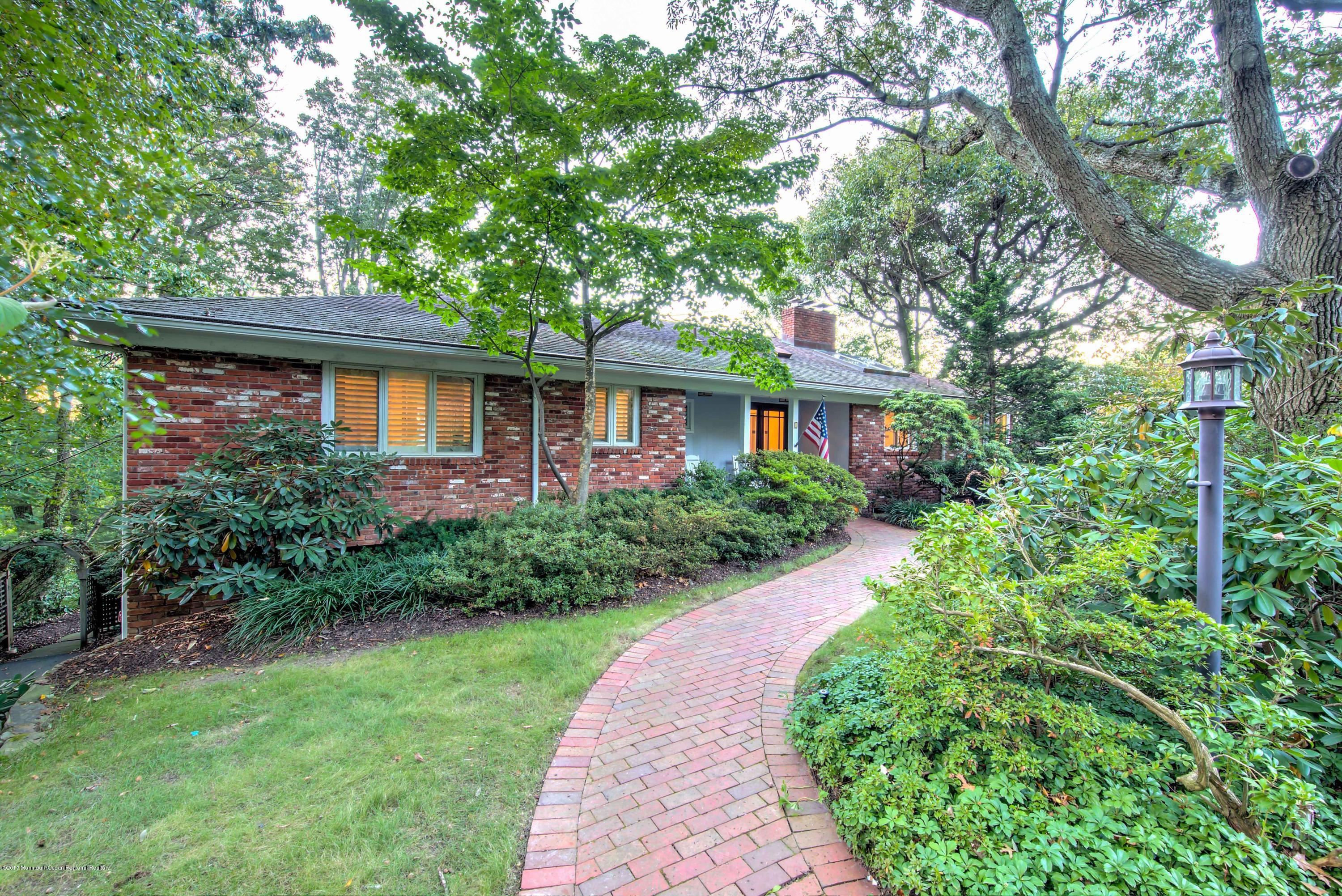 1 Hook Harbor Road Atlantic Highlands, NJ 07716 - Photo 9 of 40 a front view of a house with a yard