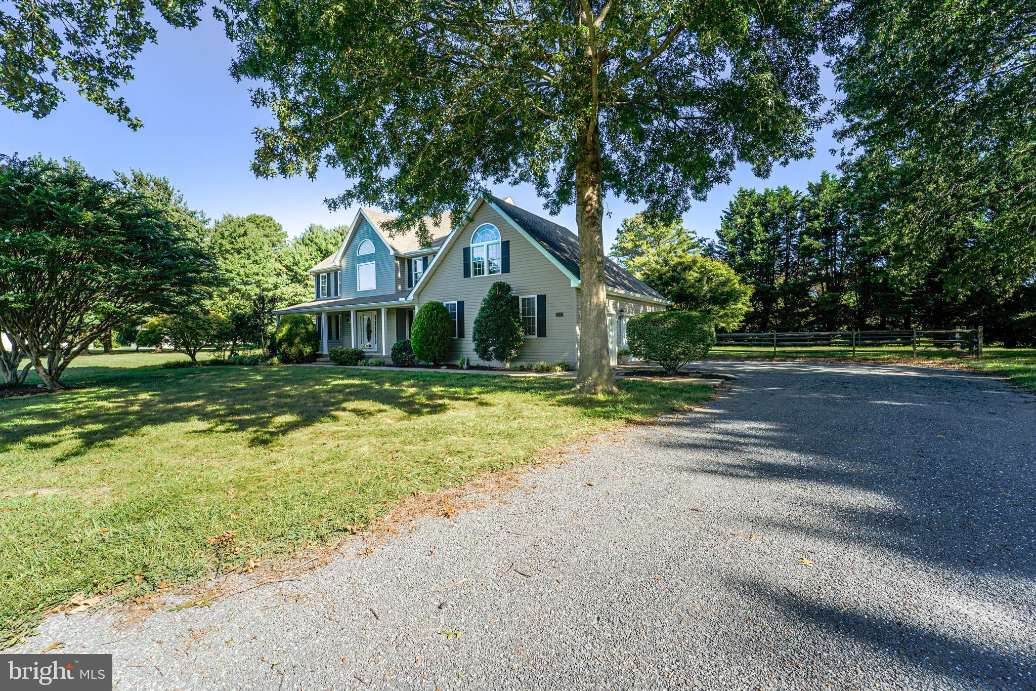 144 River Run Queenstown, MD 21658 - Photo 14 of 52 a front view of a house with a yard