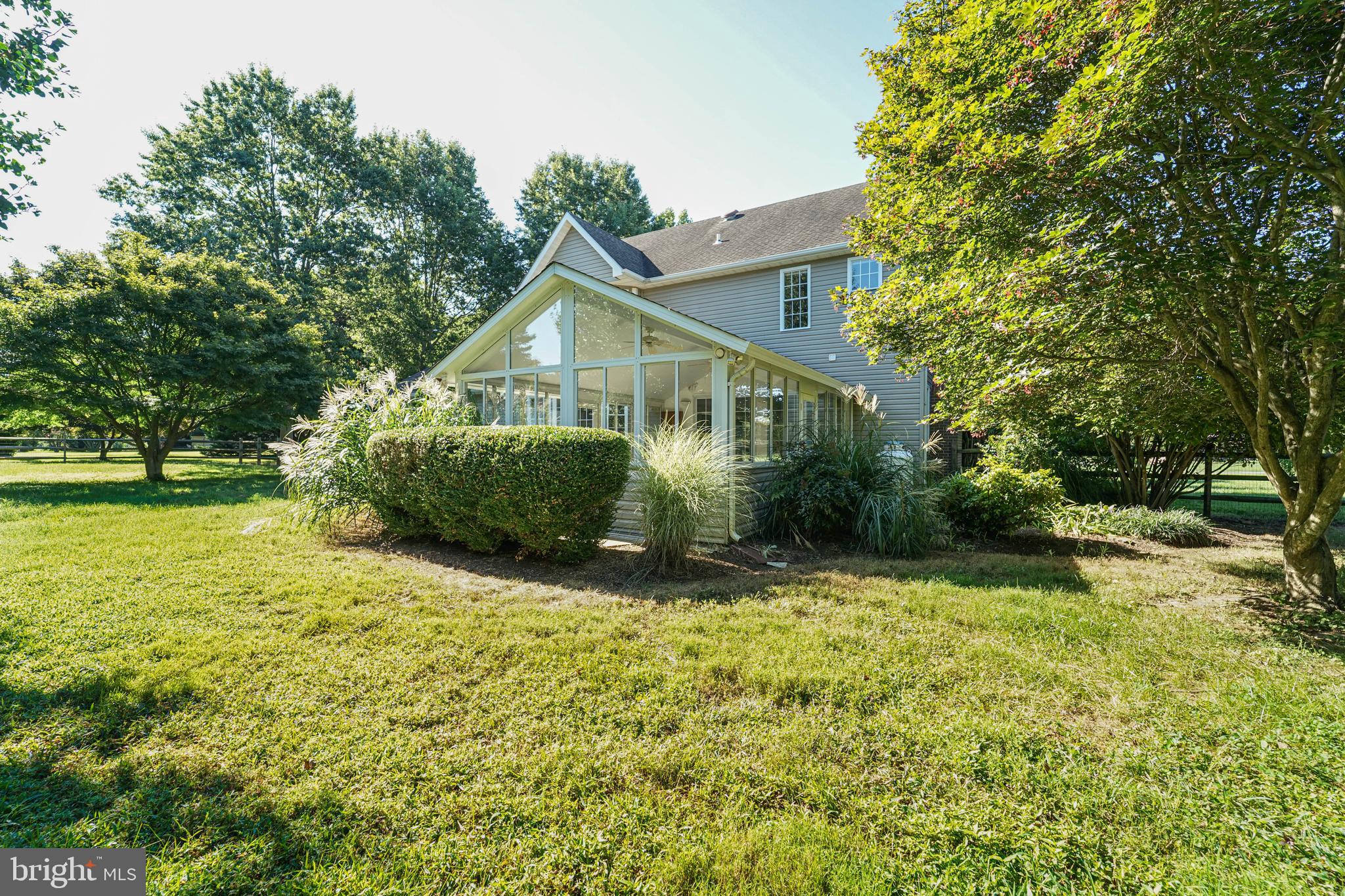 144 River Run Queenstown, MD 21658 - Photo 17 of 52 a view of a house with a yard