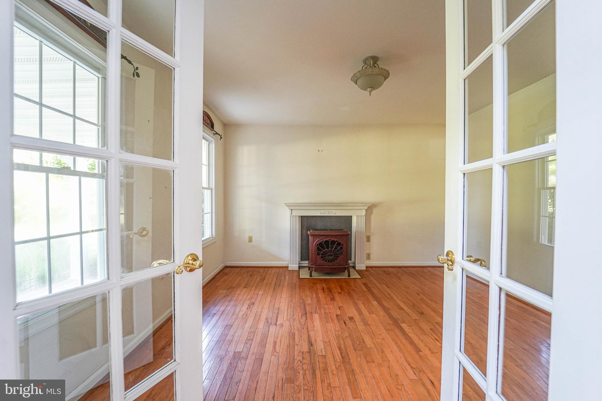 144 River Run Queenstown, MD 21658 - Photo 22 of 52 a view of a livingroom with wooden floor and a fireplace