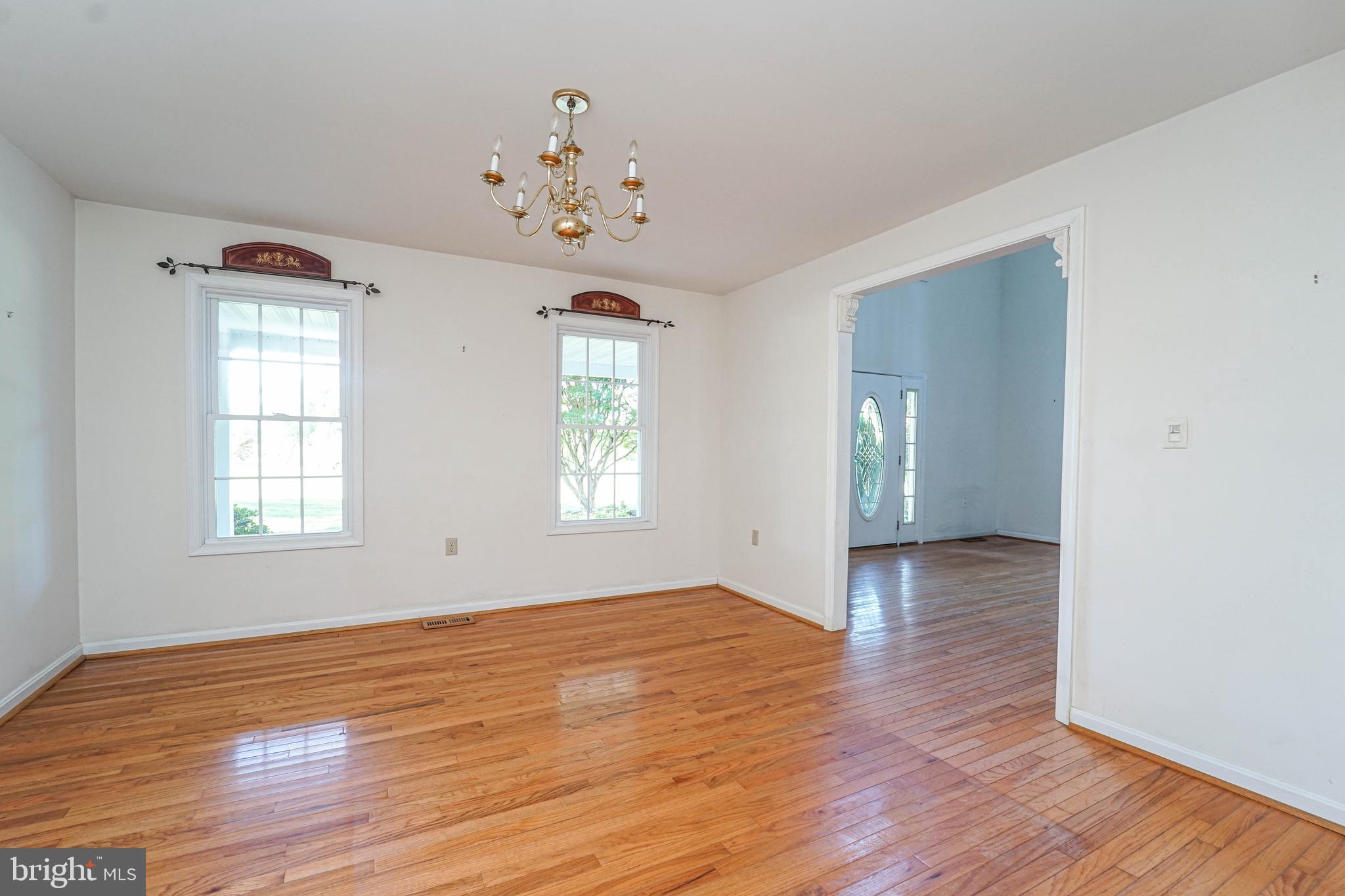144 River Run Queenstown, MD 21658 - Photo 28 of 52 an empty room with wooden floor and window