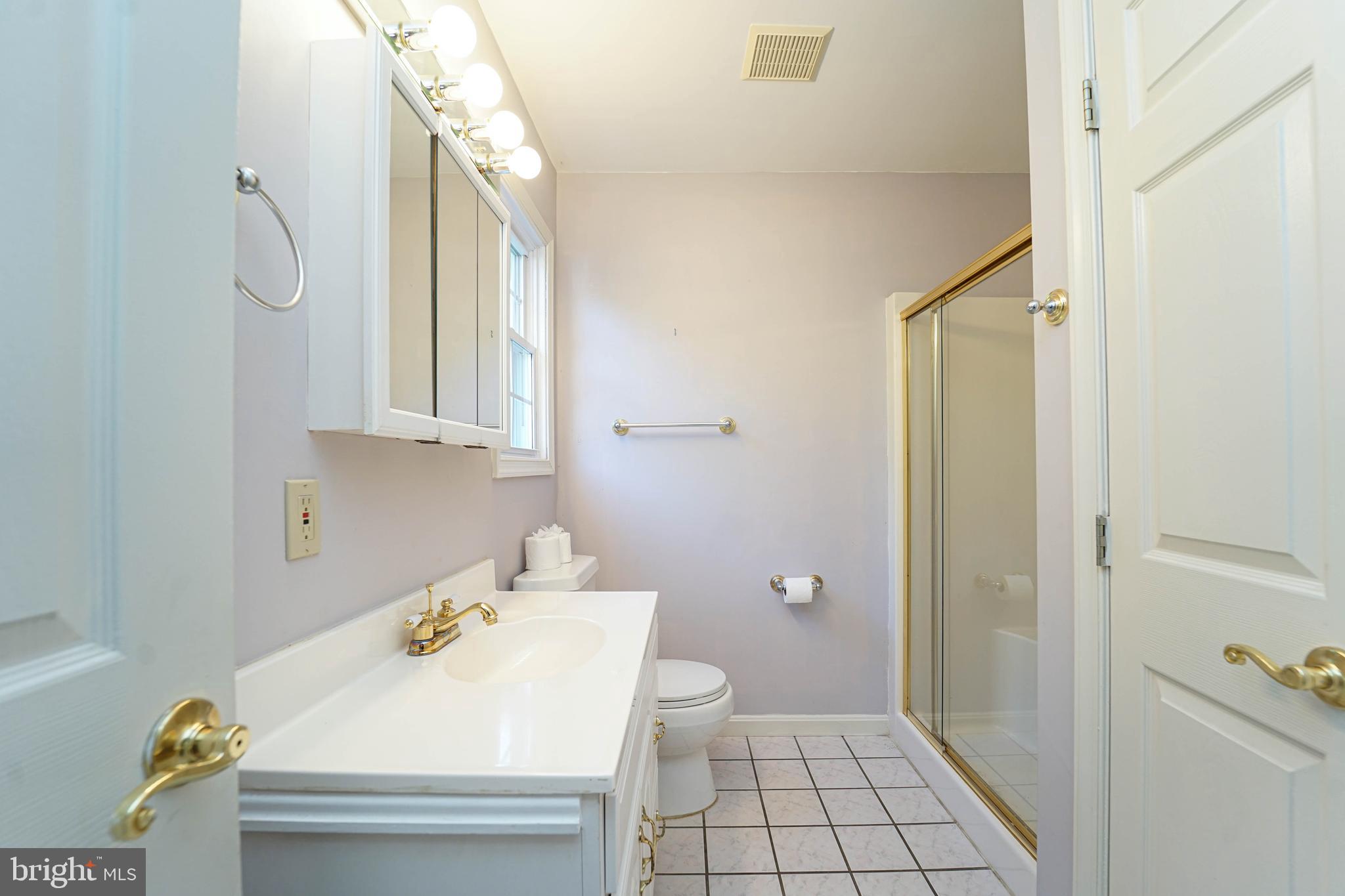 144 River Run Queenstown, MD 21658 - Photo 33 of 52 a bathroom with a sink toilet and shower