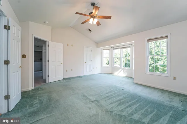 a bathroom with a sink toilet vanity and shower