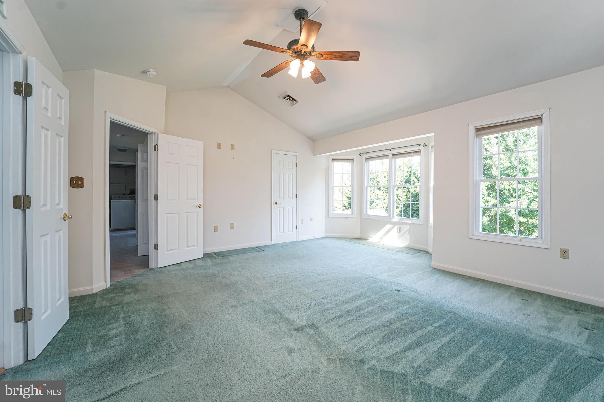 144 River Run Queenstown, MD 21658 - Photo 42 of 52 a view of a livingroom with a ceiling fan and window