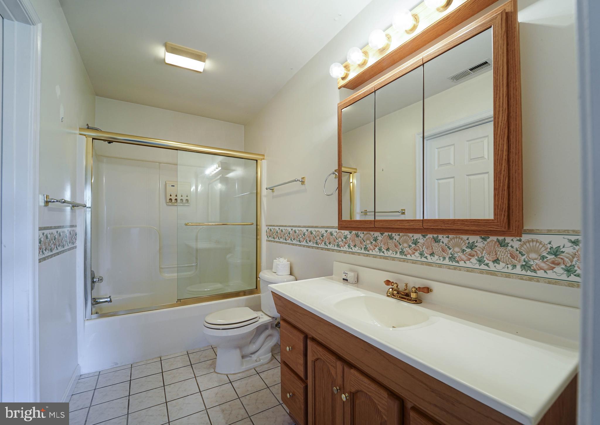 144 River Run Queenstown, MD 21658 - Photo 43 of 52 a bathroom with a sink toilet vanity and shower