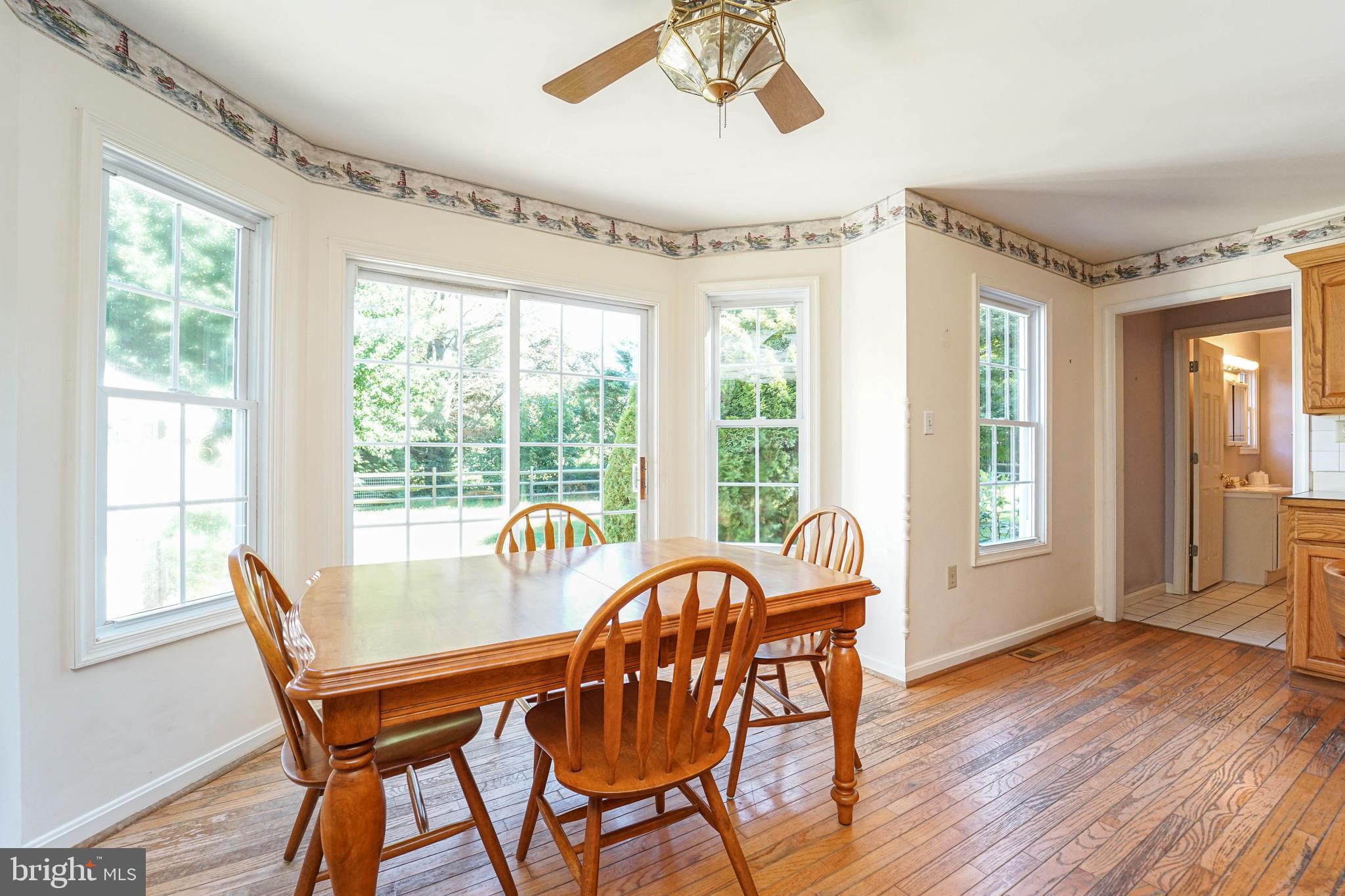 144 River Run Queenstown, MD 21658 - Photo 51 of 52 a dining room with furniture window wooden floor