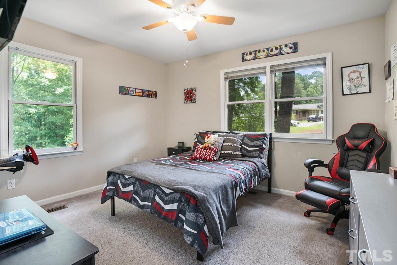 479 Ridgecrest Trail Henderson, NC 27537 - Photo 12 of 19 a bedroom with a bed gym equipment and a window
