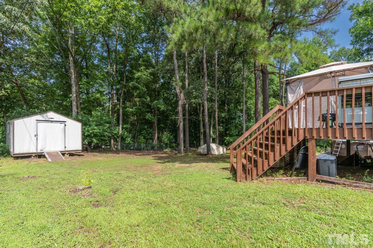 479 Ridgecrest Trail Henderson, NC 27537 - Photo 16 of 19 a view of a house with backyard and deck