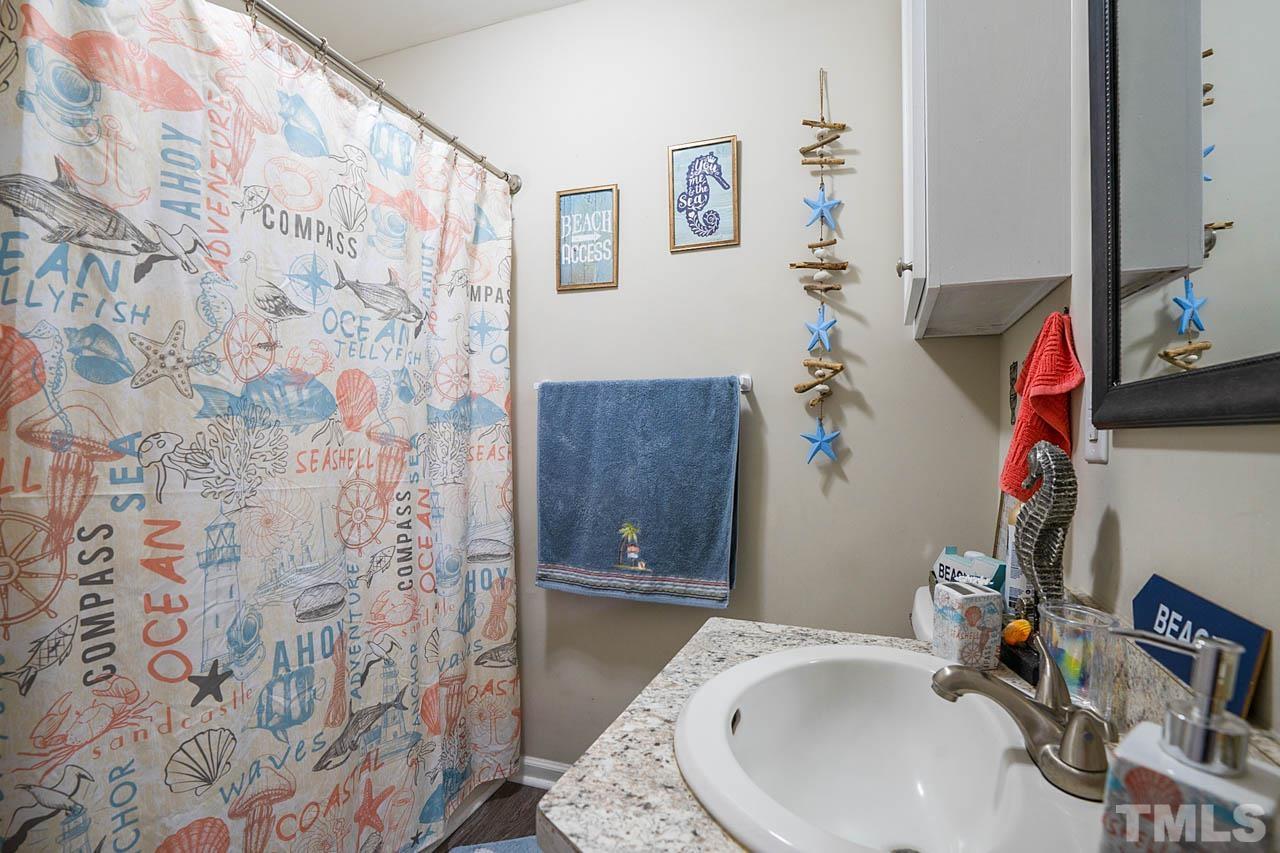 479 Ridgecrest Trail Henderson, NC 27537 - Photo 18 of 19 a bathroom with a sink toilet and shower