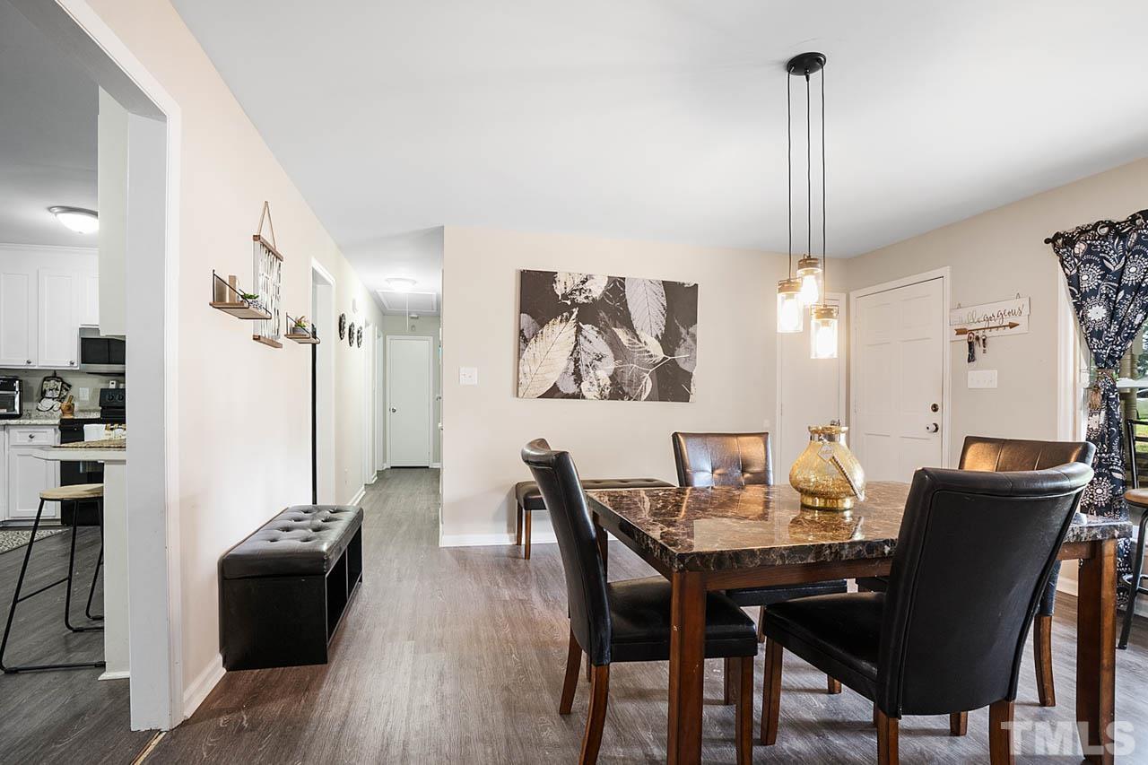 479 Ridgecrest Trail Henderson, NC 27537 - Photo 3 of 19 a view of a dining room with furniture