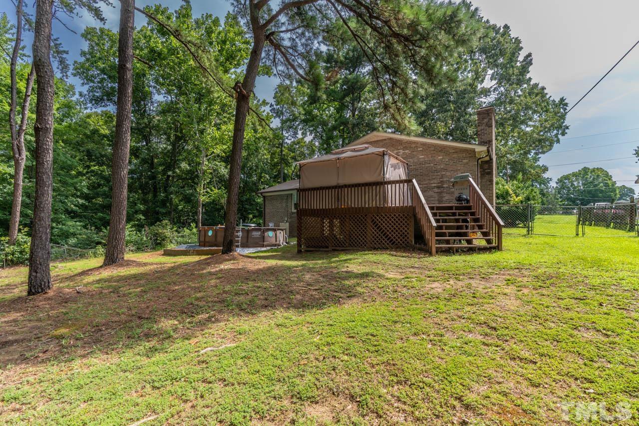 479 Ridgecrest Trail Henderson, NC 27537 - Photo 5 of 19 a backyard of a house with lots of green space