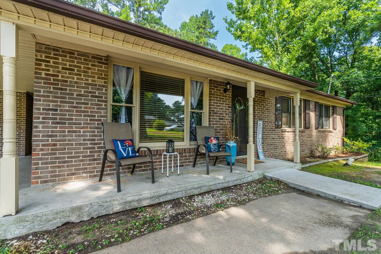 479 Ridgecrest Trail Henderson, NC 27537 - Photo 6 of 19 a view of a house with backyard sitting area and garden