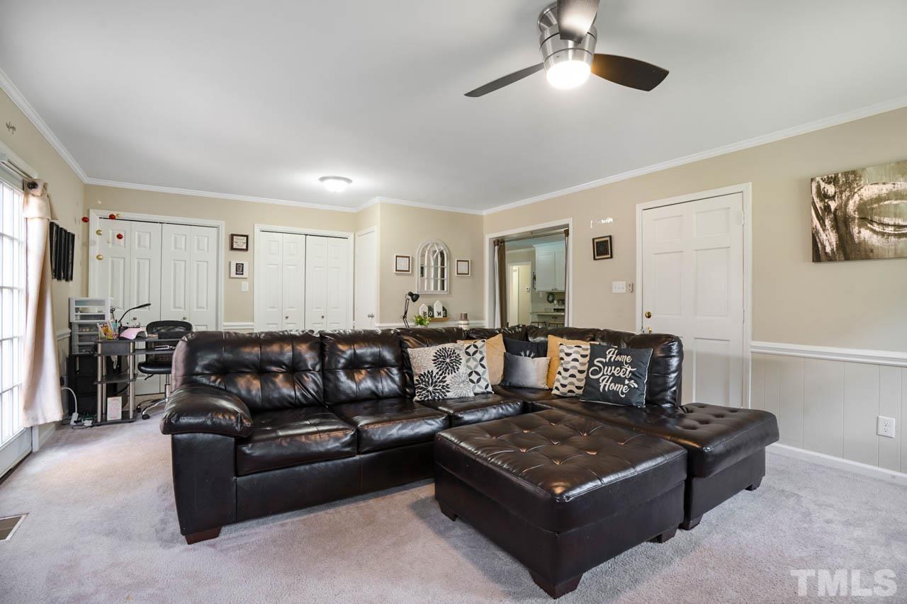 479 Ridgecrest Trail Henderson, NC 27537 - Photo 10 of 19 a living room with furniture and a ceiling fan