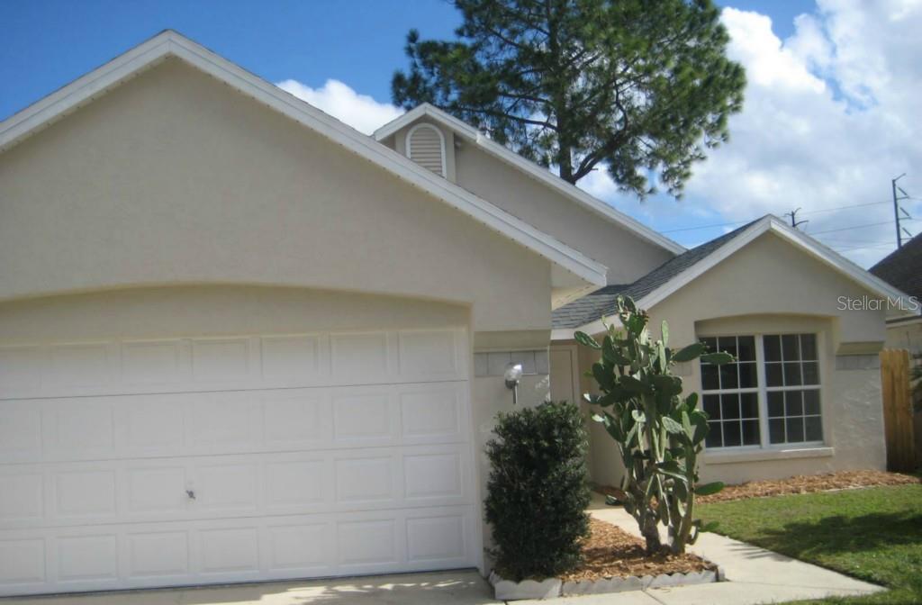 611 Weybridge Court Lake Mary, FL 32746 - Photo 1 of 1 a front view of a house with garden