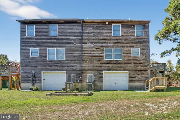 a brick house that has a large door