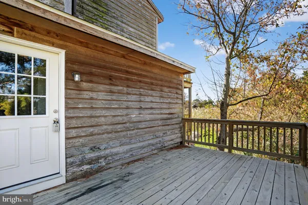 a view of outdoor space with wooden floor and deck