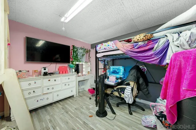 a room with furniture and a flat screen tv