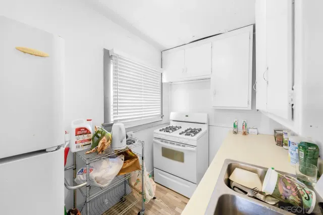 a bathroom with a sink toilet and mirror