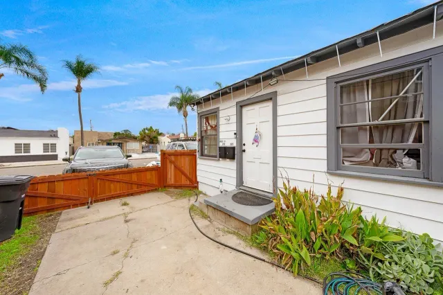a swimming pool with yard in the back
