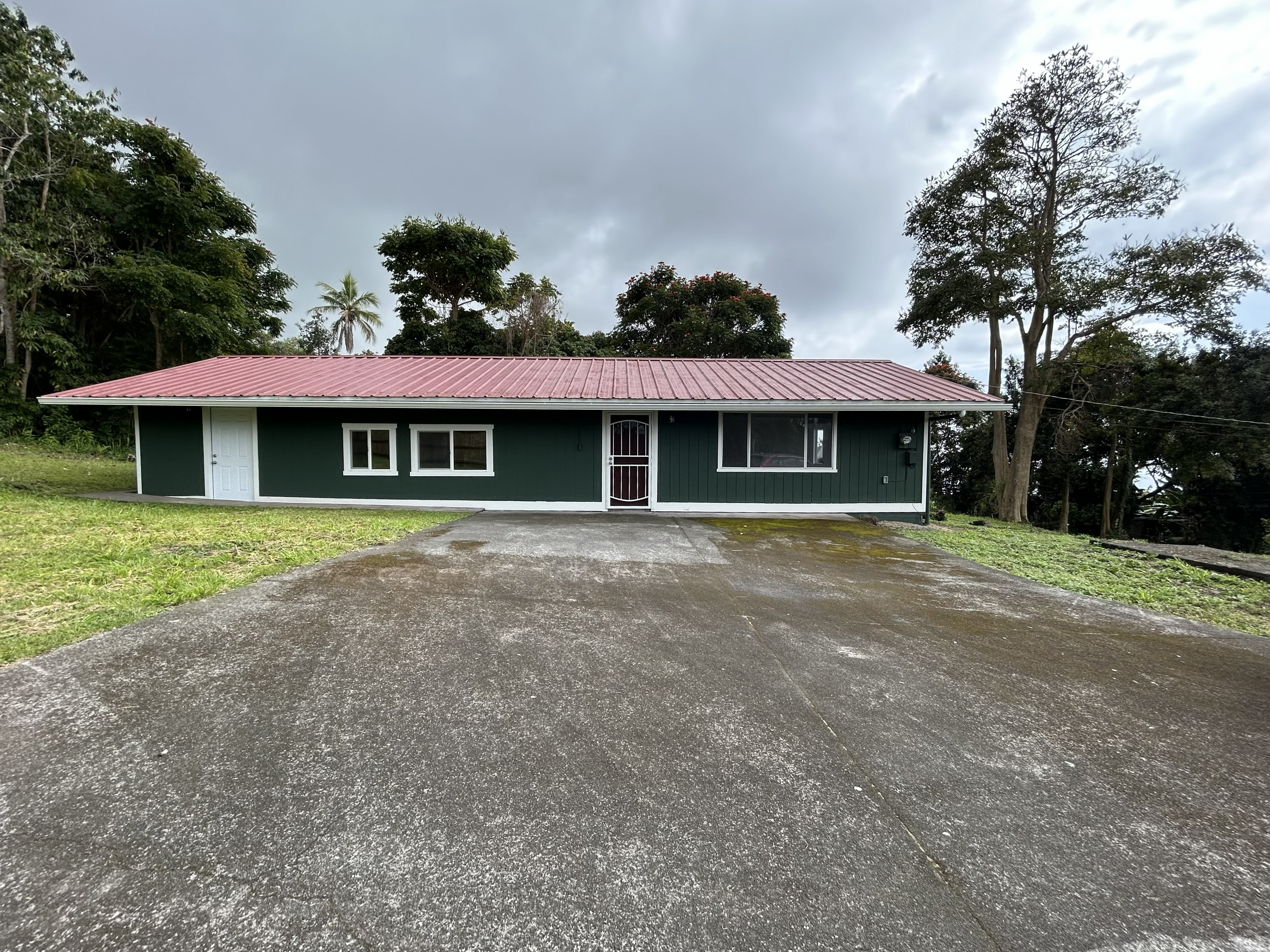 82-6136 D Road, Unit B Captain Cook, HI 96704 - Photo 18 of 30 a front view of a house with a yard