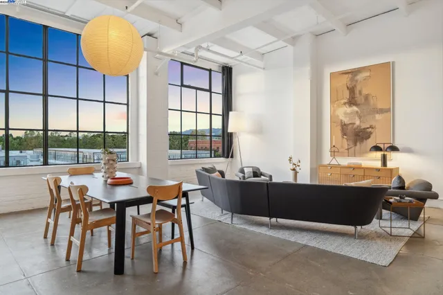 a view of a dining room with furniture and window