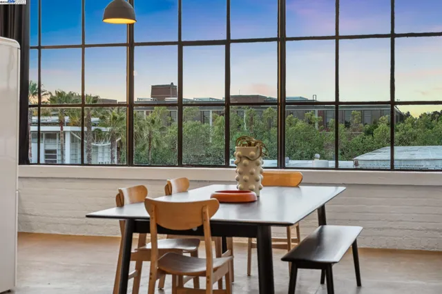 a bedroom with furniture and a large window