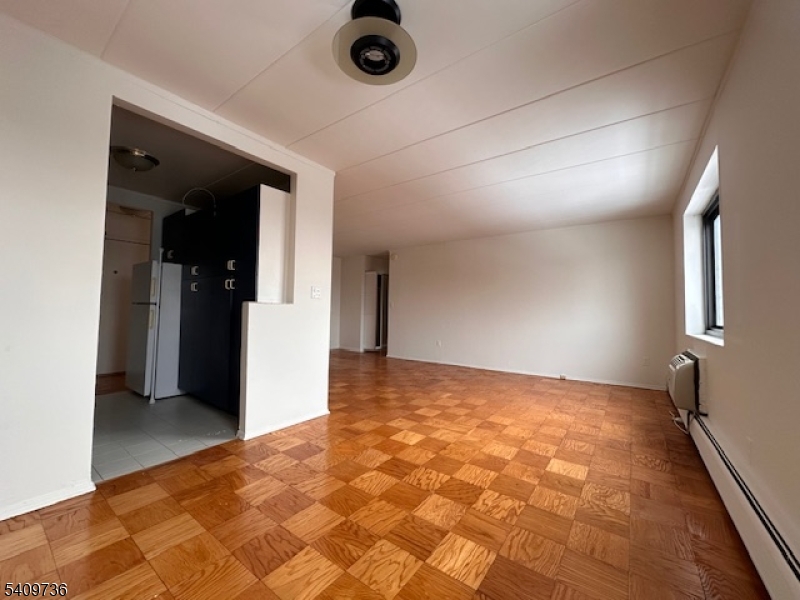 77 Prospect Avenue, Unit H Hackensack, NJ 07601 - Photo 3 of 17 wooden floor in a room