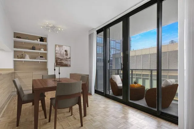 a dining room with furniture and window