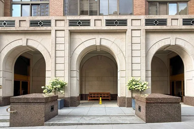 a view of a house with potted plants