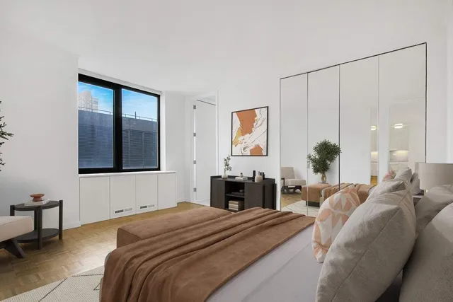 a living room with furniture a rug and a flat screen tv