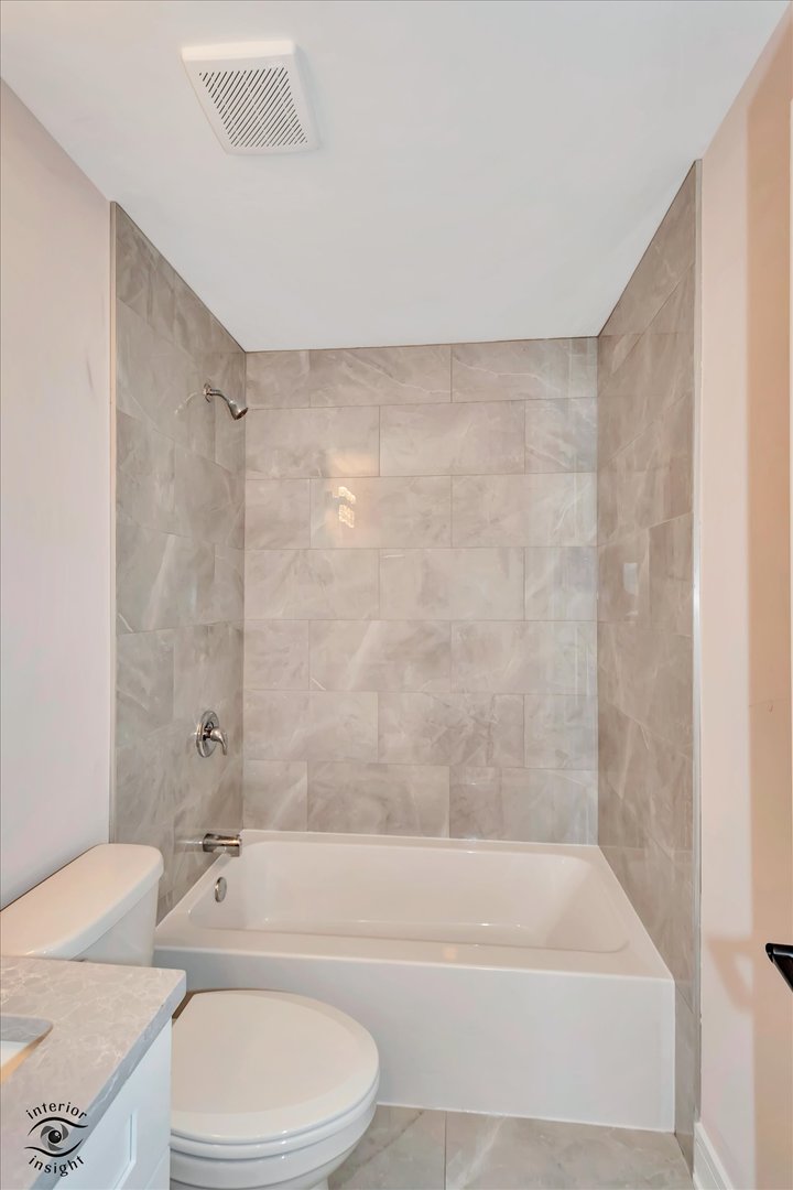4996 Ribbon Drive Monee, IL 60449 - Photo 24 of 28 a bathroom with a bathtub shower sink vanity and toilet