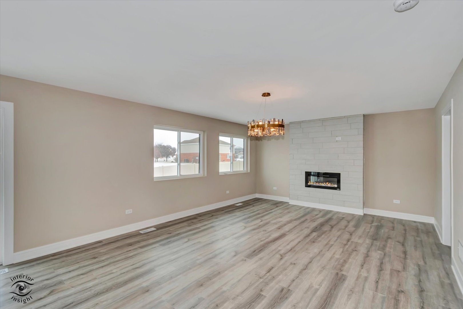 4996 Ribbon Drive Monee, IL 60449 - Photo 10 of 28 an empty room with wooden floor and windows