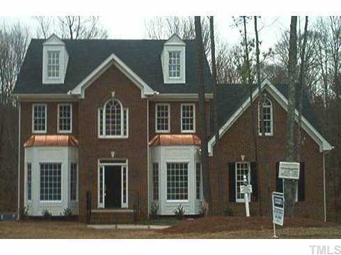 2713 Sunnystone Way Raleigh, NC 27613 - Photo 1 of 1 a view of a brick house with large windows and a yard