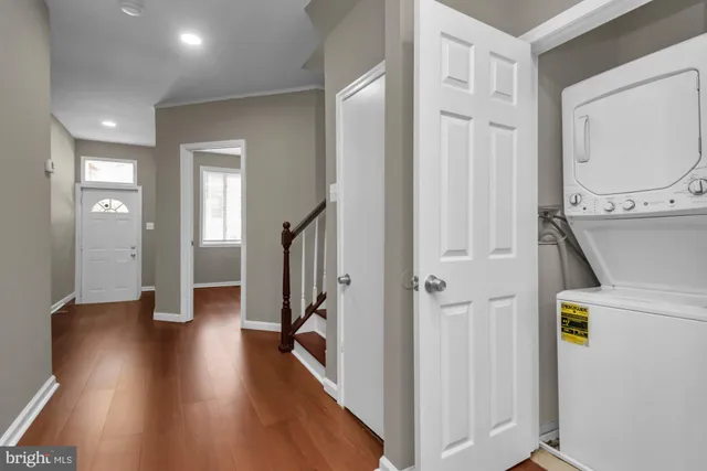 a view of hallway with wooden floor
