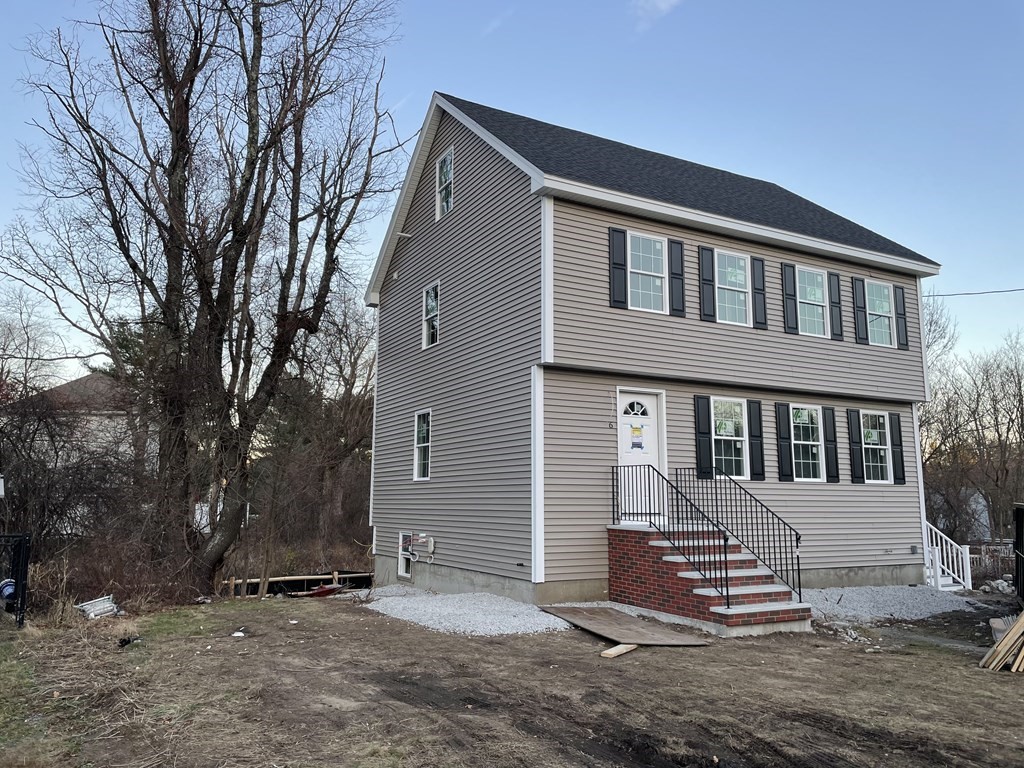 6 Allen Rd Extension Billerica, MA 01821 - Photo 1 of 17 a front view of a house with a yard