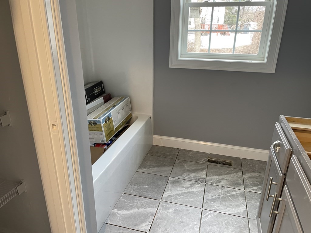 6 Allen Rd Extension Billerica, MA 01821 - Photo 16 of 17 a view of an empty room with wooden floor and a window