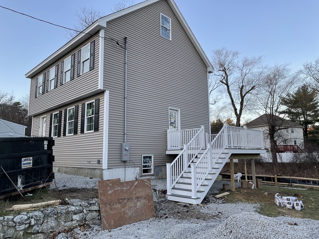 6 Allen Rd Extension Billerica, MA 01821 - Photo 3 of 17 a view of a house with a yard