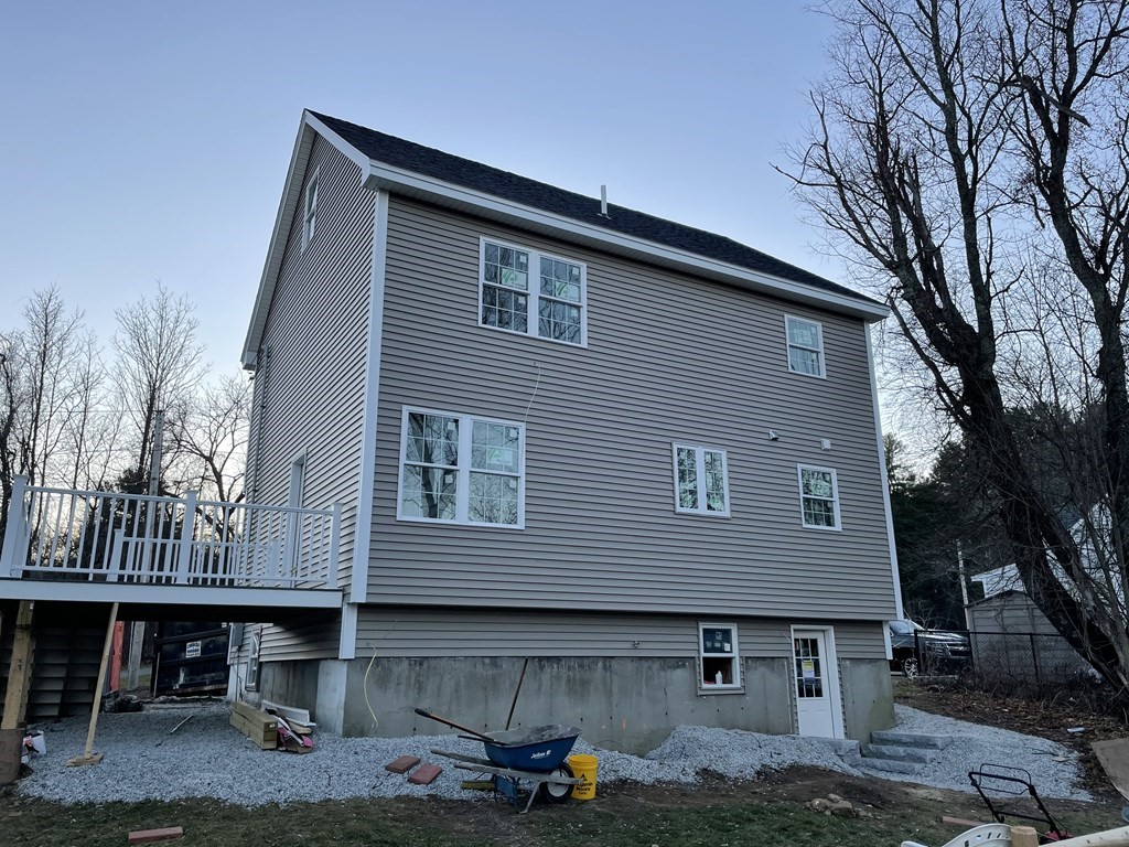 6 Allen Rd Extension Billerica, MA 01821 - Photo 4 of 17 a front view of a house with yard and seating area