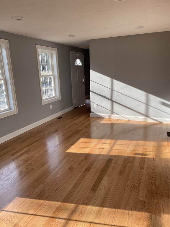 6 Allen Rd Extension Billerica, MA 01821 - Photo 5 of 17 a view of wooden floor and windows in a room